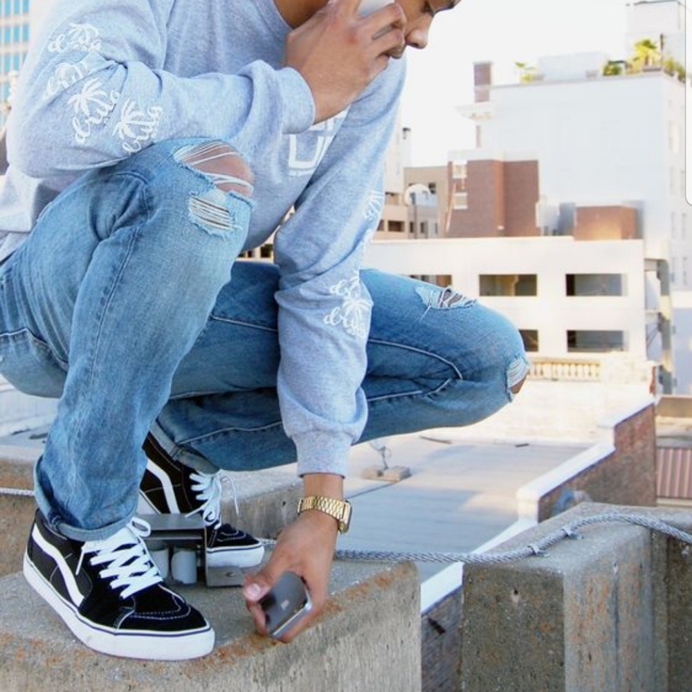 Black and white SK8-HI Vans